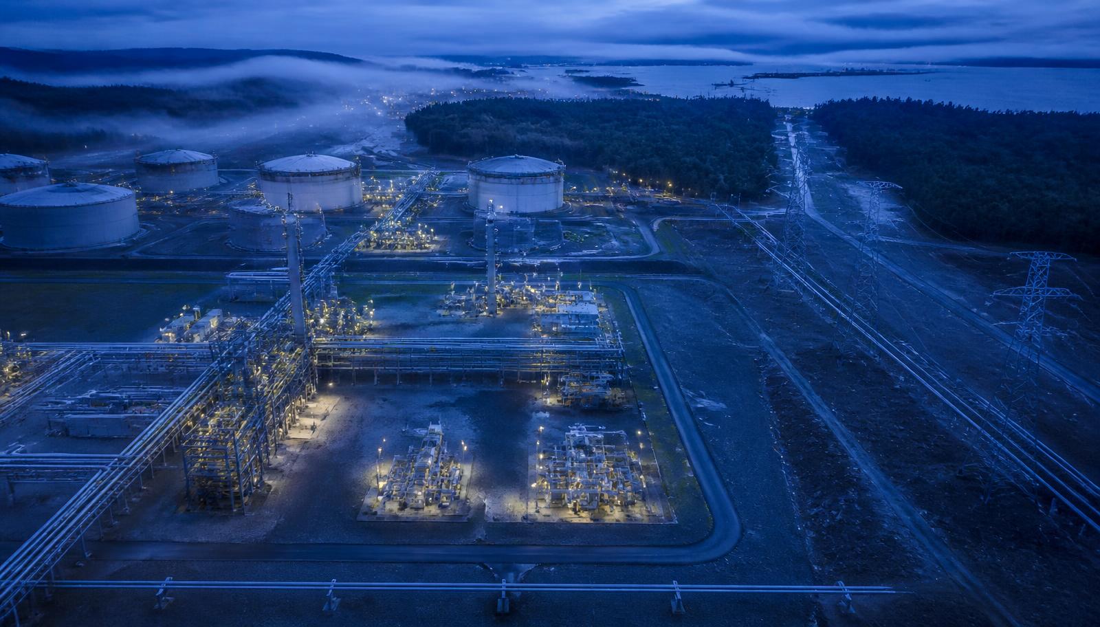 Aerial view of an energy and infrastructure site at blue hour